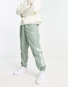 Зеленые спортивные брюки из плетеной ткани adidas Originals Rekive Cut &amp; Sew