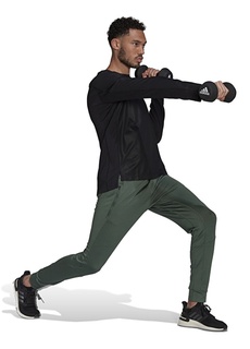 Зеленые мужские спортивные штаны приталенного кроя Adidas