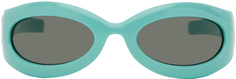 Синие овальные солнцезащитные очки Gucci