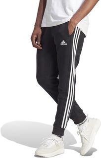 Флисовые брюки с зауженными манжетами и тремя полосками Essentials adidas, цвет Black/White
