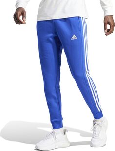 Флисовые брюки с зауженными манжетами и тремя полосками Essentials adidas, цвет Semi Lucid Blue