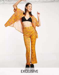 Плашеные брюки-клеш COLLUSION с абстрактным цветочным принтом персикового цвета
