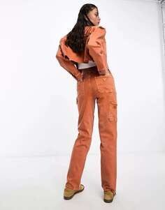 Оранжевые джинсы Guess Originals со вставками Carpenter