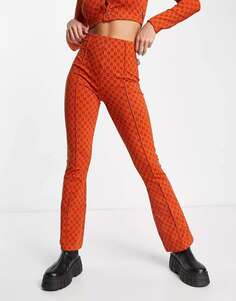 Оранжевые брюки-клеш в стиле ретро Fila