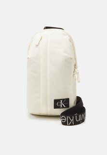 Дорожный рюкзак Logo Intarsia Slingbag Unisex Calvin Klein Jeans, цвет papyrus