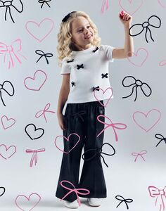 Чёрные брюки Wide leg из искусственной кожи для девочки Gloria Jeans